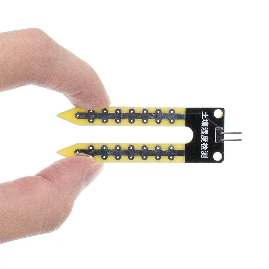 Image of komparator af jord fugtighedssensor i hånd